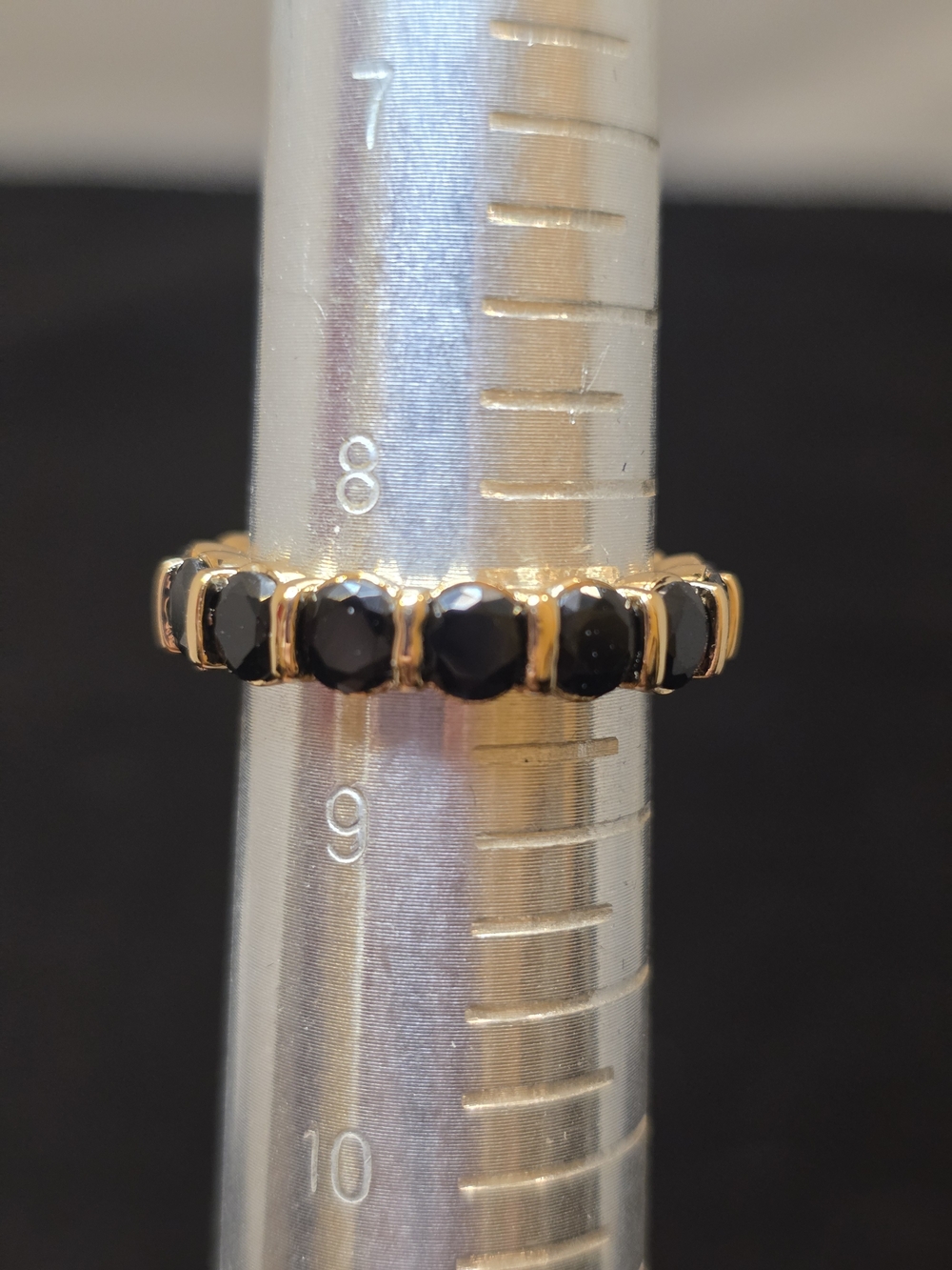 Gold Band Ring with Black Stones